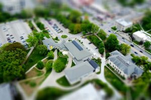 Aerial view of campus with green landscaping and parking, Manhattan, KS